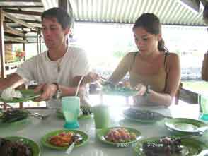 Our children in a fish restaurant in Tomohon